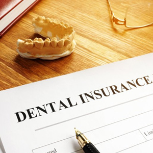 a dental insurance form on a table