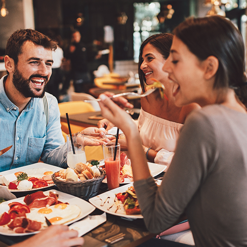 Family having dinner around table