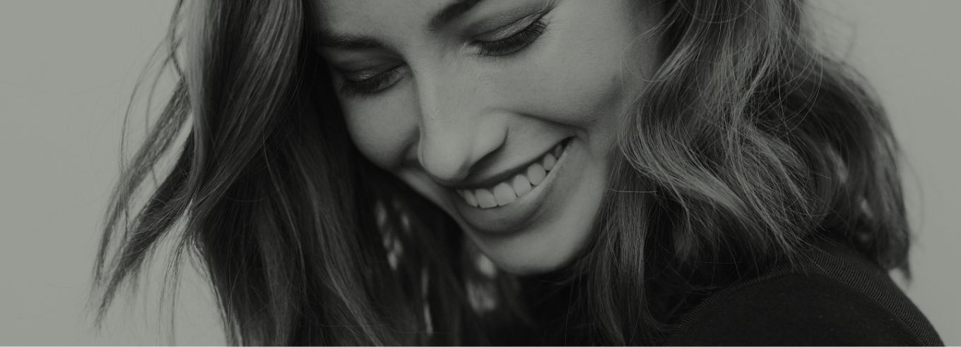 Black and white photo of smiling woman