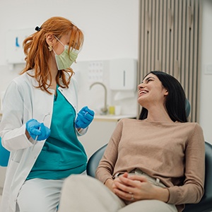 Patient smiling at dentist in treatment chair