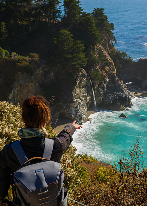 Hiker beholding a coastline