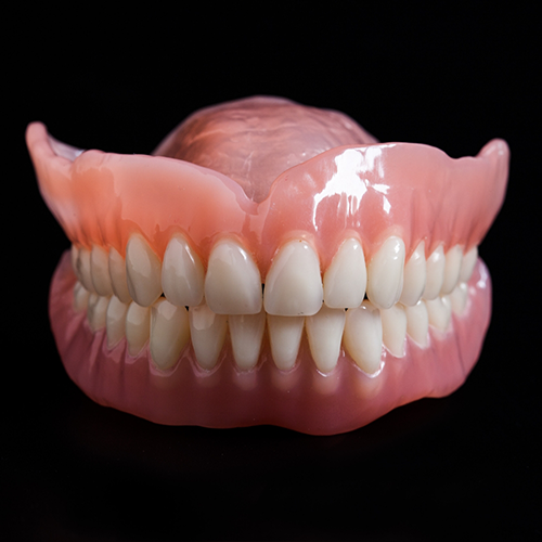 Full dentures on a black background